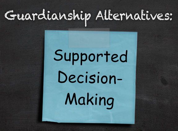 chalkboard with blue post it note that reads supported decision-making