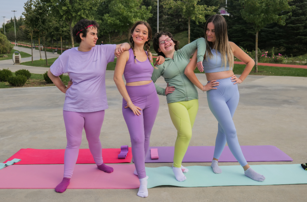 Four girls posing after doing yoga